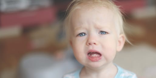Upset toddler having tummy troubles