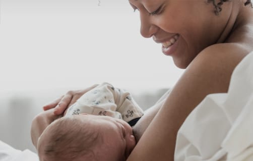 Mother breastfeeding baby