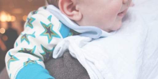 Parent burping baby