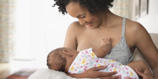 woman breastfeeding her infant