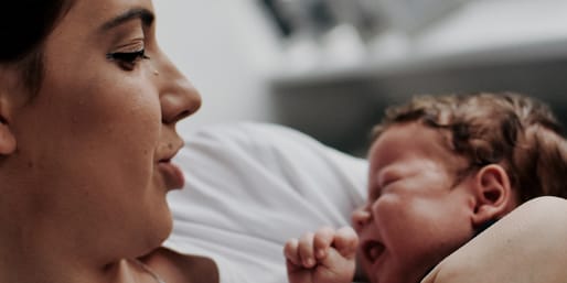 Mother soothing crying baby