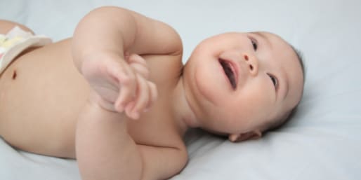 Baby smiling and looking up