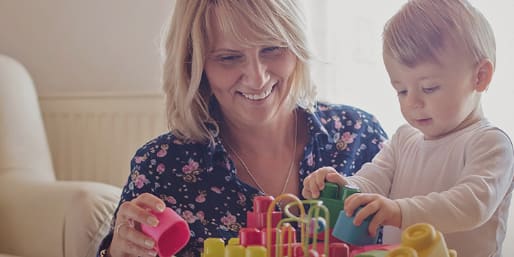 Mother and child building with blocks