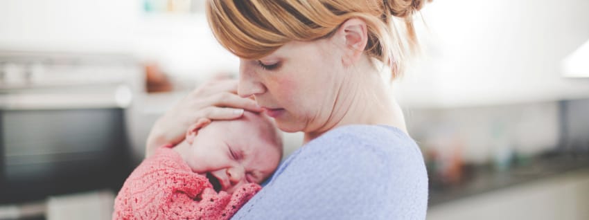 Mother comforting crying baby