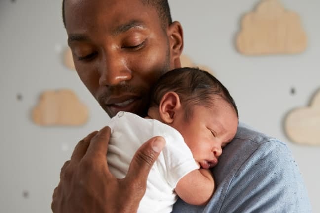 Parent comforting a baby