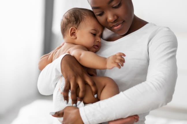 Mother holding and soothing her baby