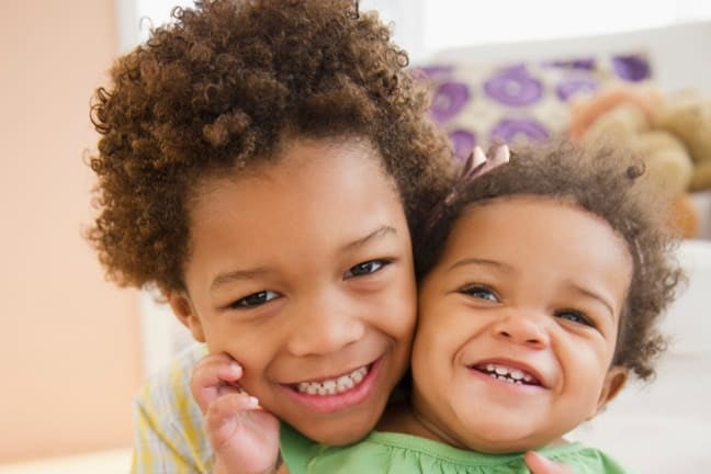 Child and infant laughing